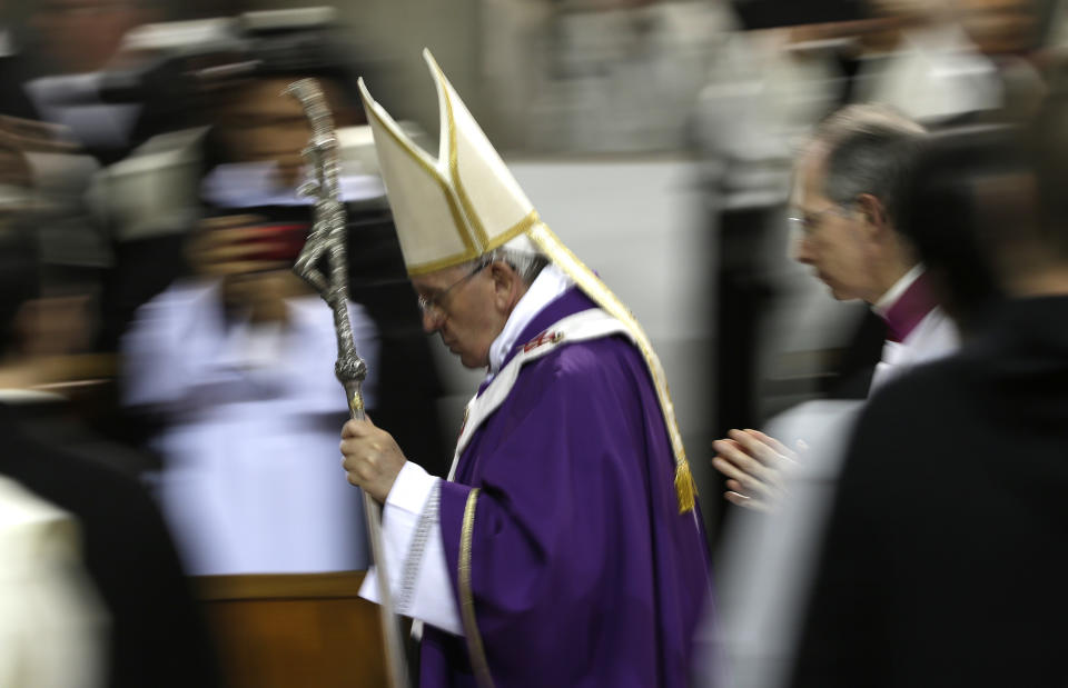 Pope Francis leaves after celebrating the Ash Wednesday mass at the Santa Sabina Basilica in Rome, Wednesday, March 5, 2014. Ash Wednesday marks the beginning of Lent, a solemn period of 40 days of prayer and self-denial leading up to Easter. (AP Photo/Max Rossi, Pool)