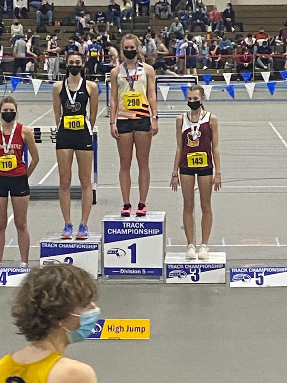 Joseph Case's Hannah Santos, far right, stands at the podium during the Division V state meet. Santos placed third in the high jump.