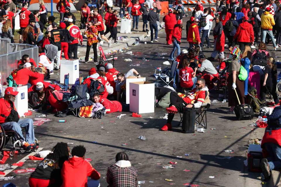 <p>Jamie Squire/Getty</p>  People take cover during a shooting at Union Station during the Kansas City Chiefs Super Bowl LVIII victory parade on February 14, 2024 in Kansas City, Missouri.