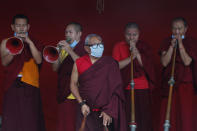 Buddhist monks play traditional instruments during the funeral of veteran Nepalese Sherpa guide Ang Rita, at Sherpa Monastery in Kathmandu, Nepal, Wednesday, Sept. 23, 2020. Ang Rita, who was the first person to climb Mount Everest 10 times has died Monday at age 72 after a long illness. (AP Photo/Niranjan Shrestha)