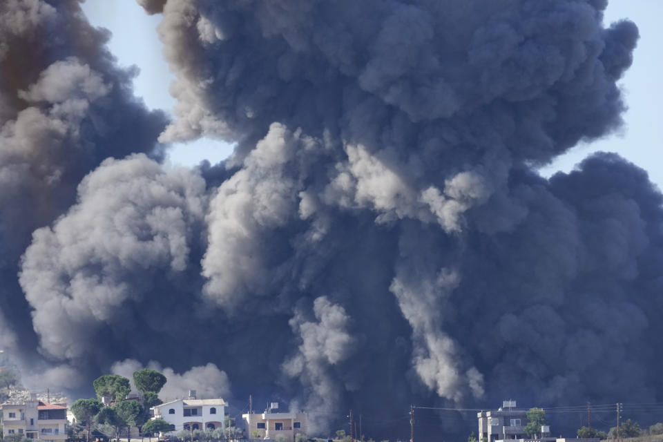 Black smoke rises from an Israeli airstrike on the outskirts of Aita al-Shaab, a Lebanese border village with Israel, south Lebanon, Saturday, Nov. 4, 2023. The Lebanon-Israel border has been the site of regular clashes between Israeli forces on one side and Hezbollah and Palestinian armed groups on the other since the beginning of the Israel-Hamas war. (AP Photo/Hussein Malla)