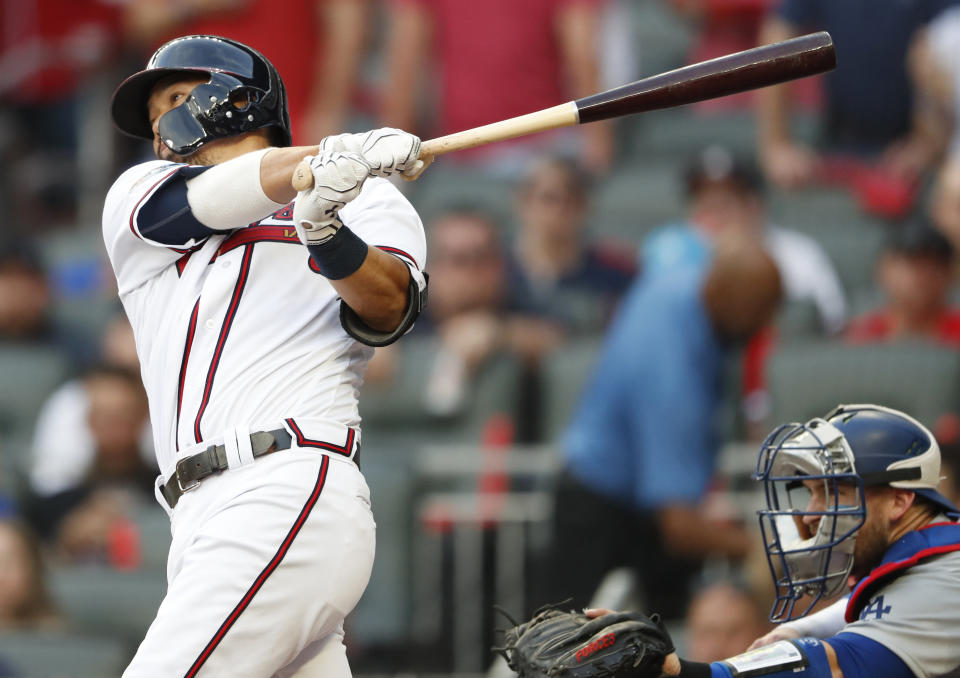 Atlanta Braves' Kurt Suzuki (24) hits a 2 RBI single against the Los Angeles Dodgers during the fourth inning in Game 4 of baseball's National League Division Series, Monday, Oct. 8, 2018, in Atlanta. (AP Photo/John Bazemore)