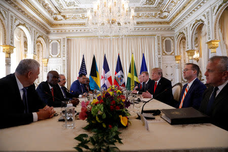 U.S. President Donald Trump takes part in a working visit with Saint Lucia Prime Minister Allen Chastanet, Haiti's President Jovenel Moise, Jamaica's Prime Minister Andrew Holness, Bahamas Prime Minister Hubert Minnis, White House national security adviser John Bolton, Acting U.S. Defense Secretary Patrick Shanahan, Acting White House Chief of Staff Mick Mulvaney and U.S. Deputy Secretary of State John J. Sullivan at Mar-a-Lago in Palm Beach, Florida, U.S., March 22, 2019. REUTERS/Kevin Lamarque