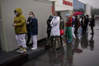 Health care workers wait in line to be vaccinated with Pfizer/Biontech COVID-19 vaccines at the MontLegia CHC hospital in Liege, Belgium, Wednesday, Jan. 27, 2021. The 27-nation EU is coming under criticism for the slow rollout of its vaccination campaign. The bloc, a collection of many of the richest countries in the world, is not faring well in comparison to countries like Israel, the United Kingdom and the United States. (AP Photo/Francisco Seco)