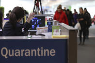 A thermal camera monitor shows the body temperature of passengers arriving from overseas at Incheon International Airport in Incheon, South Korea, Tuesday, Jan. 21, 2020. Heightened precautions were being taken in China and elsewhere Tuesday as governments strove to control the outbreak of a novel coronavirus that threatens to grow during the Lunar New Year travel rush. (Suh Myung-geon/Yonhap via AP)