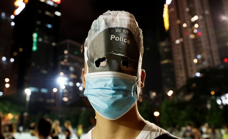 Anti-government protesters wearing costumes march during Halloween in Hong Kong