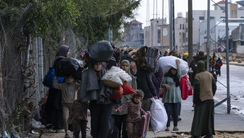 Palestinians arrive in the southern Gaza town of Rafah after fleeing an Israeli ground and air offensive in the nearby city of Khan Younis on Monday, Jan. 29, 2024. Israel has expanded its offensive in Khan Younis, saying the city is a stronghold of the Hamas militant group. 