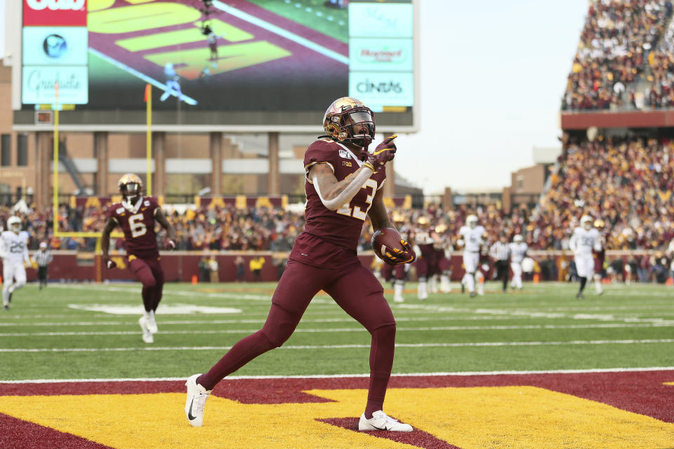 Minnesota wide receiver Rashod Bateman (13) runs the ball in the end zone for a touchdown during an NCAA college football game against Penn State, Saturday, Nov. 9, 2019, in Minneapolis. (AP Photo/Stacy Bengs)