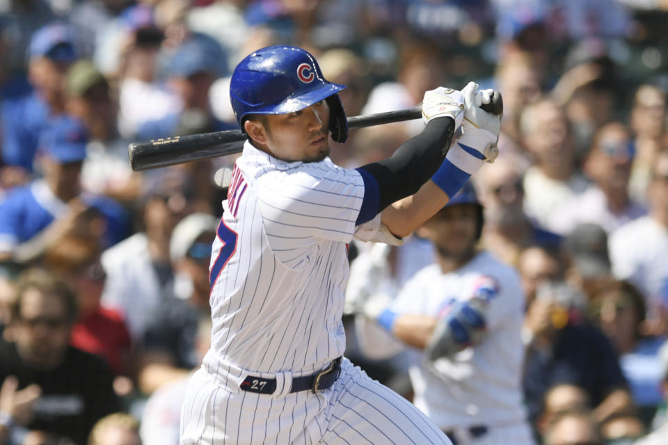 Chicago Cubs' Seiya Suzuki follows through with a three-run double during the first inning of a baseball game against the San Francisco Giants Wednesday, Sept. 6, 2023, in Chicago. (AP Photo/Paul Beaty)