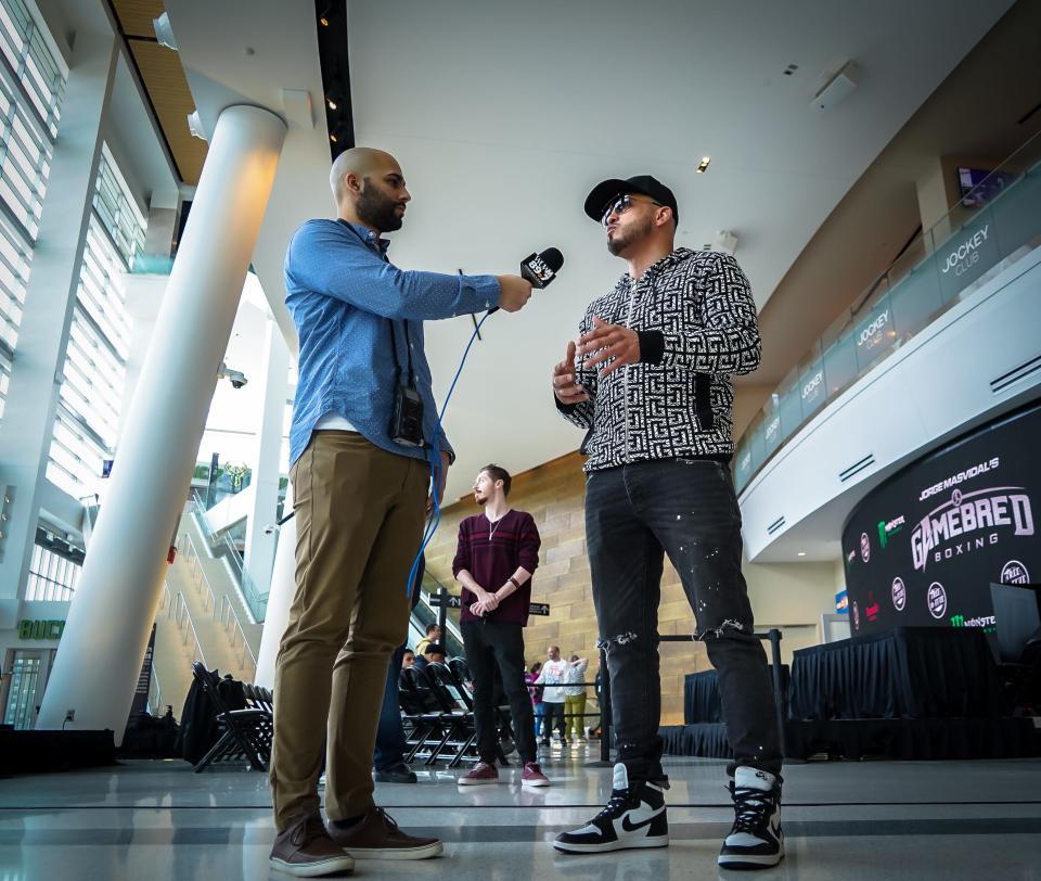 Anthony Pettis does an interview with WUWM reporter Eddie Morales after the pre-fight news conference Thursday at Fiserv Forum ahead of the Gamebred 4 boxing event Saturday. Pettis will make his pro boxing debut against Roy Jones Jr. in the main event.