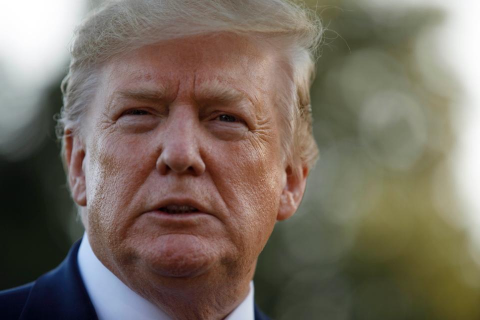 President Donald Trump pauses as he talks to media before boarding Maine One at the White House in Washington, Friday, Aug. 30, 2019, en route to Camp David in Maryland. (AP Photo/Carolyn Kaster) ORG XMIT: DCCK115