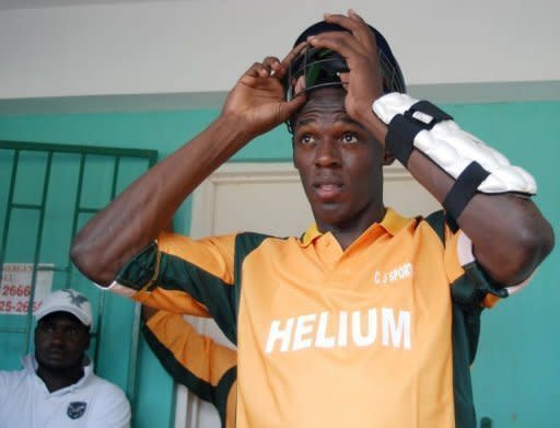 File photo shows cricket-mad sprint king Usain Bolt at a charity invitational celebrity cricket match in Jamaica in 2009. According to Australian media, Bolt clean bowled the then West Indies captain Chris Gayle in a charity match in 2009, having earlier hit him down the ground for six