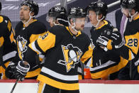 Pittsburgh Penguins' Brian Dumoulin (8) returns to the bench after scoring during the second period of an NHL hockey game against the Buffalo Sabres in Pittsburgh, Thursday, May 6, 2021. (AP Photo/Gene J. Puskar)