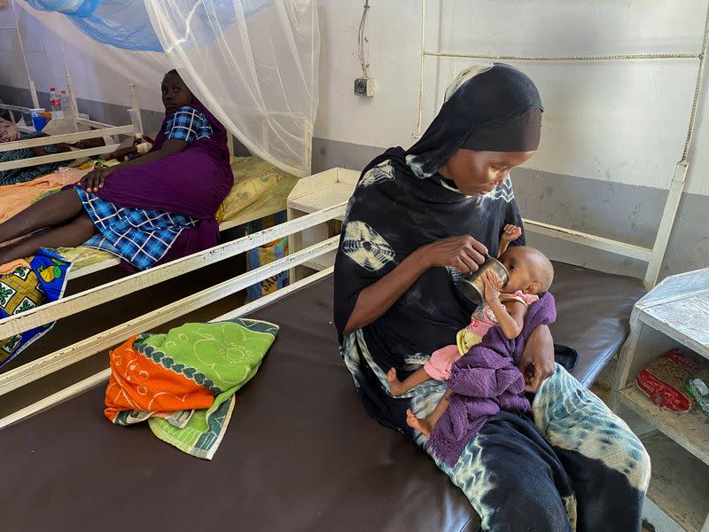 A woman feeds a malnourished baby at a makeshift MSF hospital on the day U.S. Ambassador to the United Nations, Linda Thomas-Greenfield, visited the hospital, in Adre