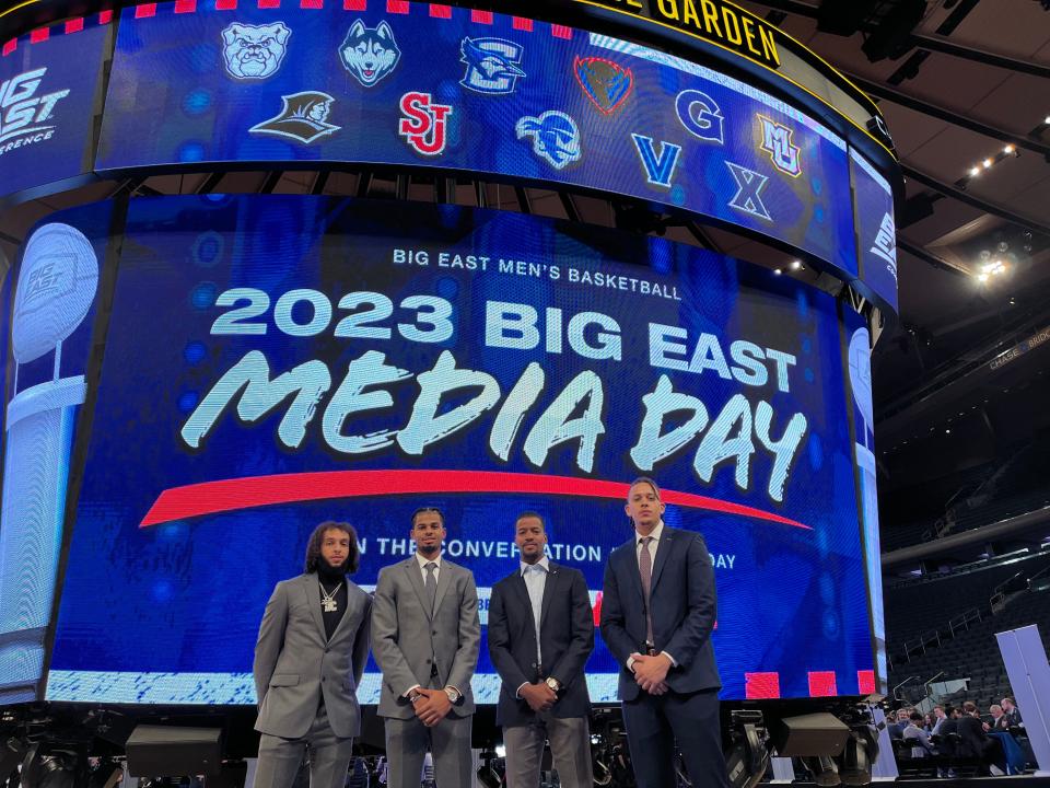 Providence College basketball players at Madison Square Garden on Tuesday for Big East Media Day. From left, Devin Carter, Bryce Hopkins, coach Kim English, Josh Oduro.