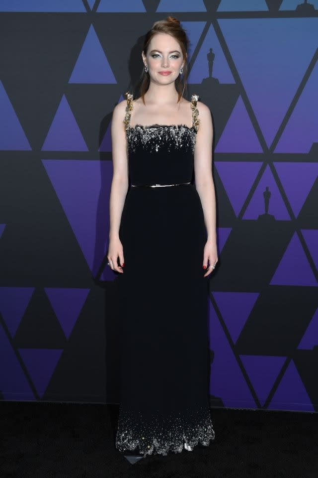 Emma Stone stunned in a black Louis Vuitton gown with metallic details in gold and silver. Hollywood, November 18, 2018