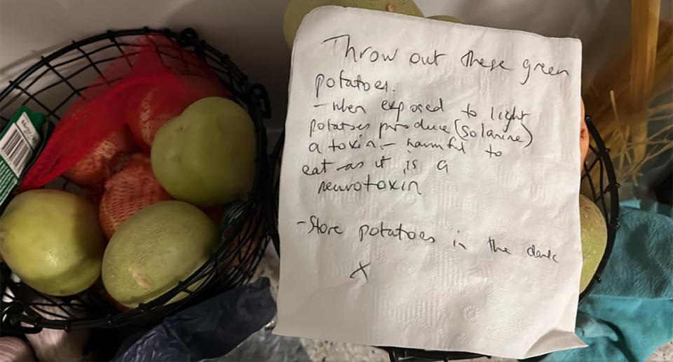 Handwritten note about green potatoes placed on basket of vegetables