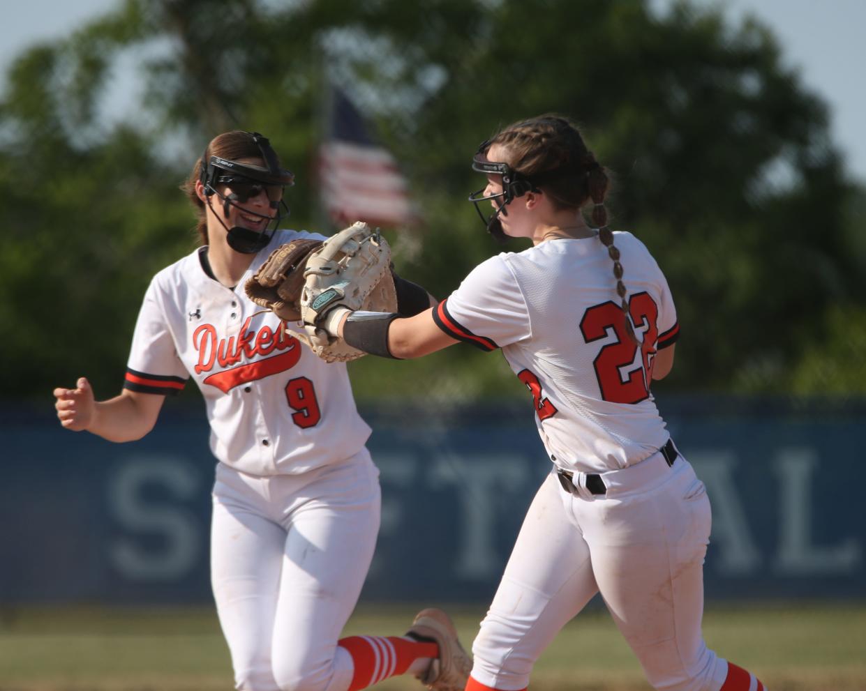 Marlboro teammates Taylor Castellani, left, and Madison Gibney celebrate a quick inning during the Class B softball subregional on May 30, 2023.