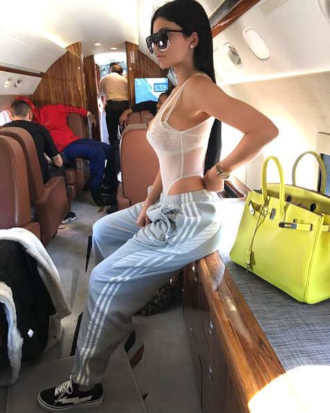 Kylie Jenner Pairs Sheer Bodysuit with Baggy Sweats on Private Jet