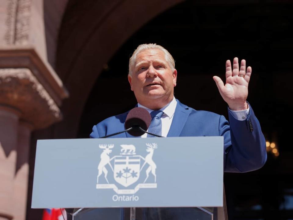 Premier Doug Ford takes his oath as his new cabinet is sworn-in during a ceremony at Queen's Park on June 24, 2022.  (Evan Mitsui/CBC - image credit)