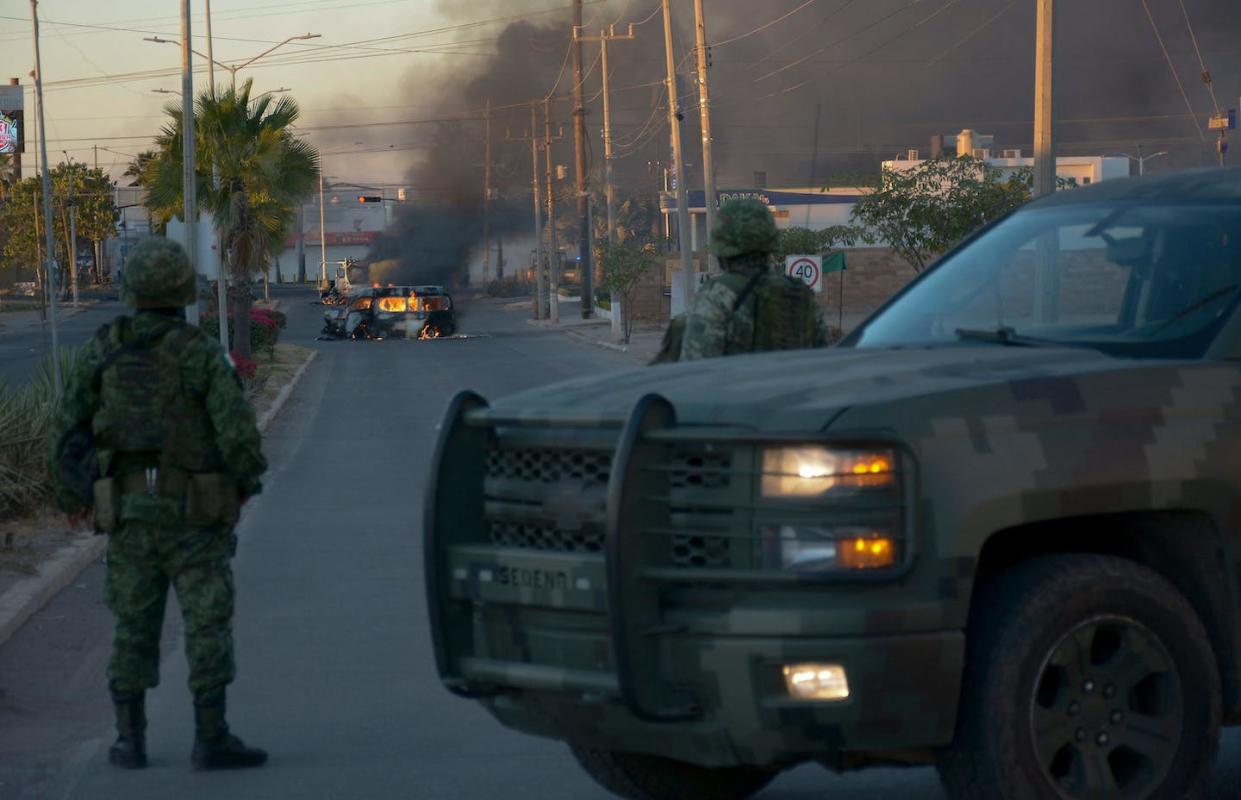 Mexican soldiers stand guard near during the arrest of Joaquin Ovidio Guzman in Culiacan, Mexico, in January 2023. <a href="https://media.gettyimages.com/id/1246022600/photo/topshot-mexico-drugs-violence-guzman-arrest.jpg?s=1024x1024&w=gi&k=20&c=VuwfDMIAXP0eeKfKdmH1zgboCcJwmwCKFNXWDaNdbvU=" rel="nofollow noopener" target="_blank" data-ylk="slk:Juan Carlos Cruz/AFP via Getty Images;elm:context_link;itc:0;sec:content-canvas" class="link ">Juan Carlos Cruz/AFP via Getty Images</a>