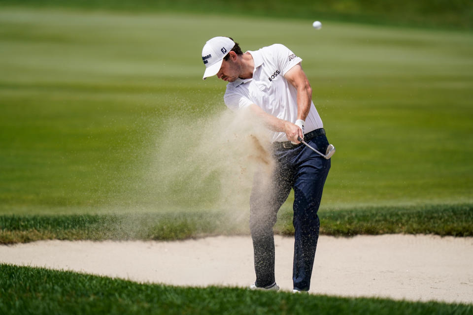 Patrick Cantlay shoots out of the bunker on the ninth hole during the second round of the Travelers Championship golf tournament at TPC River Highlands, Friday, June 24, 2022, in Cromwell, Conn. (AP Photo/Seth Wenig)