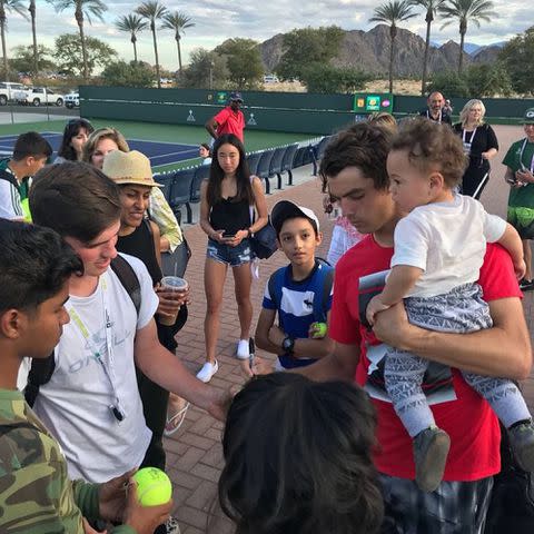 <p>Taylor Fritz Instagram</p> Taylor Fritz with his son Jordan Fritz signing autographs at the BNP Paribas Open in 2018.