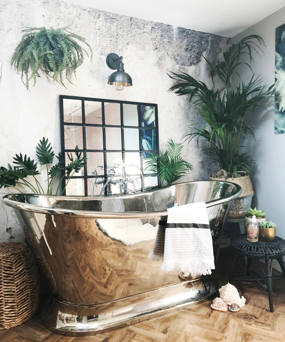 <p> Call us Magpies, but we love a bit of metallic decor – not just for the shiny and bling factor but because, as well as a good mirror idea, it also does wonders to bounce light and make the room feel bigger. </p> <p> 'The first thing we purchased was Hurlingham Baths Dietrich Copper Bath, this would form the centerpiece of the bathroom and sit centrally on the back wall for maximum impact,' says Anna Straw, an interior designer and founder of Anna's Attic. </p> <p> 'I wanted to achieve the look of an aged wall, which I felt would contrast so well with the shiny nickel. Murals Wallpaper supplied me with their Crumble mural, which is the perfect contrast to our highly-polished bath.' </p> <p> 'The lighting needed reviewing, we started out with one central ceiling light and one wall light, the ceiling light was removed and replaced with spotlights and the wall light was moved to above the bath and replaced with Industville’s 8 inch pewter Brooklyn Dome wall light, this vintage-style perfectly complements the mural and window frame mirror above which it hangs.  </p> <p> 'We are lucky to have a Velux in the bathroom, which lets in tons of natural light and is so lovely at night when laid in the bath.' </p>