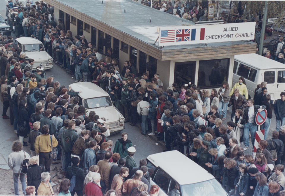 West Germans applaud as East Berlin citizens travel through Checkpoint Charlie, at the Berlin Wall, at the border of West Berlin, West Germany on Nov. 10, 1989. (Photo: Reuters)