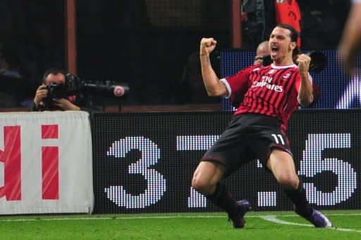 AC Milan's Swedish forward Zlatan Ibrahimovic celebrates after scoring against Roma at the San Siro in Milan on Saturday