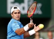 Facundo Arguello of Argentina plays a shot to Andy Murray of Britain during their men's singles match at the French Open tennis tournament at the Roland Garros stadium in Paris, France, May 25, 2015. REUTERS/Jean-Paul Pelissier