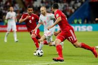 Soccer Football - World Cup - Group B - Iran vs Spain - Kazan Arena, Kazan, Russia - June 20, 2018 Spain's Andres Iniesta in action with Iran's Mehdi Taremi and Omid Ebrahimi REUTERS/Toru Hanai