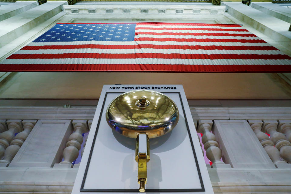 The bell used to open and close the markets hangs in front of an empty podium above the floor of the New York Stock Exchange (NYSE) as it prepares to close due to the coronavirus disease (COVID-19) outbreak in New York, U.S., March 20, 2020.  REUTERS/Lucas Jackson     TPX IMAGES OF THE DAY