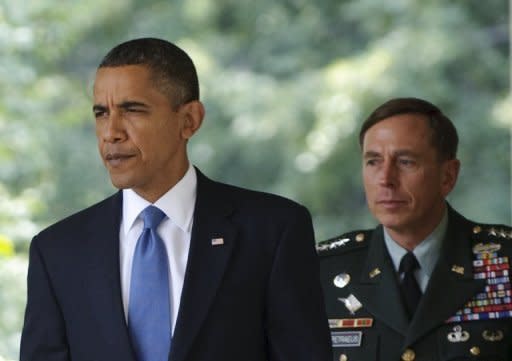 US President Barack Obama (L) and General David Petraeus make their way to the Rose Garden at the White House for a statement by Obama in 2010. The FBI uncovered the affair that led to the resignation of Petraeus while investigating threatening emails sent by his lover to a second woman, US media reported Sunday