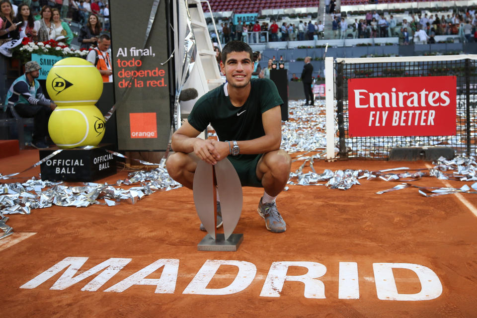 Carlos Alcaraz, pictured here with the trophy after winning the Madrid Open.