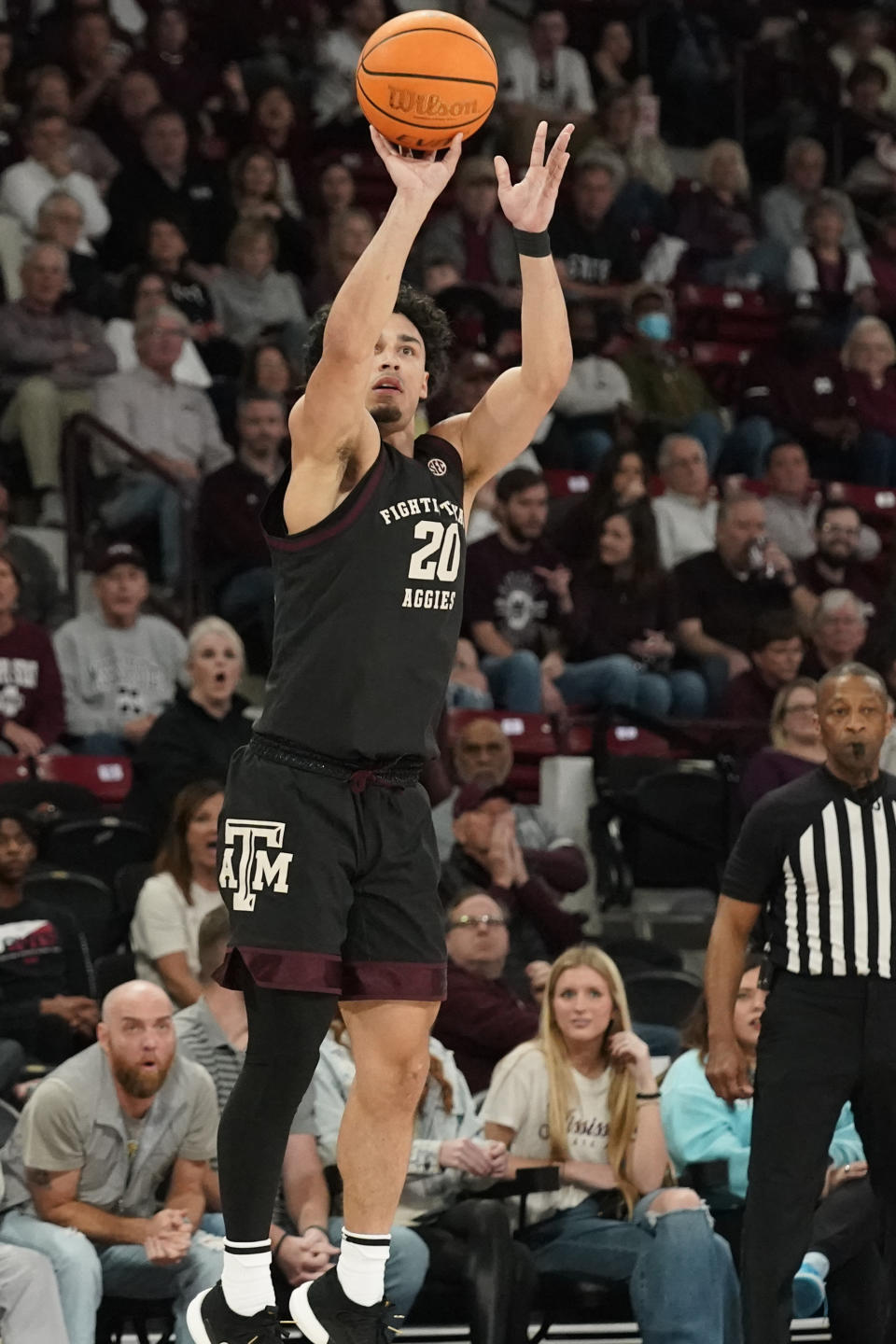 Texas A&M guard Andre Gordon (20) is unguarded as he attempts a three-point shot during the first half of an NCAA college basketball game against Mississippi State in Starkville, Miss., Saturday, Feb. 25, 2023. (AP Photo/Rogelio V. Solis)