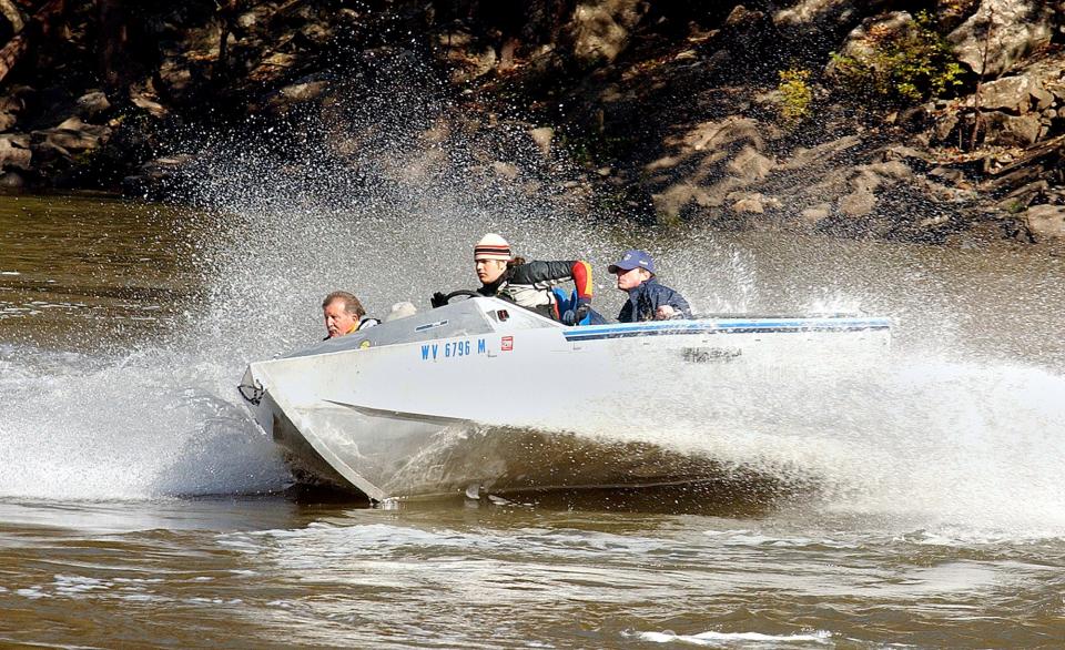 An emergency rescue boat speeds to aid a BASE jumper who was killed in 2006 after his parachute failed to fully open following a leap from  the New River Gorge Bridge in Fayetteville, W.Va. AP Photo/The Register-Herald, Lew Whitener