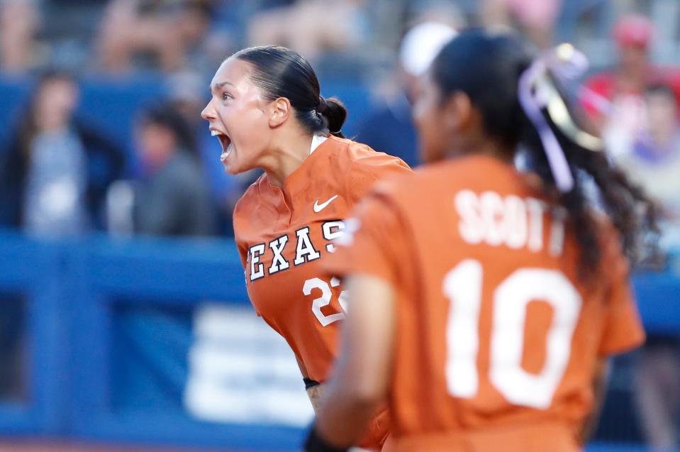 Texas' Estelle Czech (22) celebrates after her team defeated Arizona 5-2 on Sunday night in Oklahoma City.