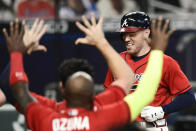 Atlanta Braves' Freddie Freeman crosses home plate to score on a winning two-run home during the 11th inning of a baseball game against the Boston Red Sox, Friday, Sept. 25, 2020, in Atlanta. (AP Photo/John Amis)