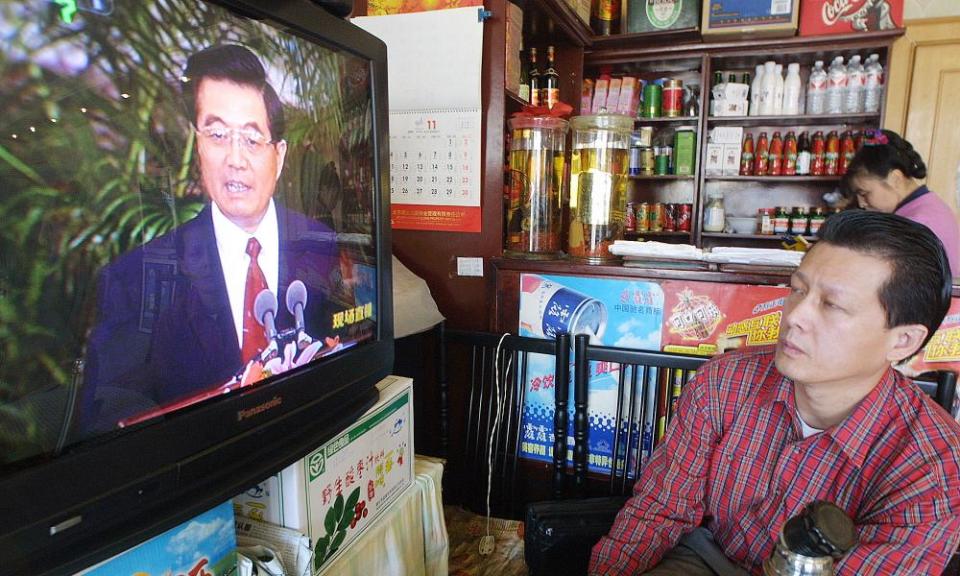 A restaurant owner watches after Hu Jintao was named general secretary of China’s Communist party in 2002