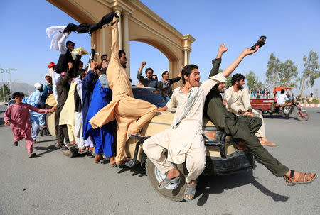 People celebrate ceasefire in Rodat district of Nangarhar province, Afghanistan June 16, 2018.REUTERS/Parwiz