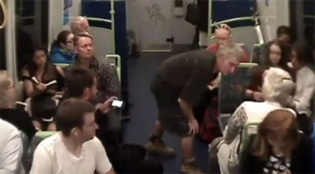 Mr Smart approached a woman on the train, leaning into her face. Photo: 7 News