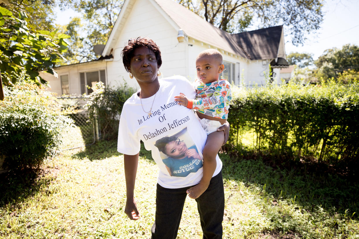 Sharon Jefferson holds her grandson, Rayray. Police say her pregnant daughter, Delashon, was fatally shot by her boyfriend in September. (Photo: Allison V. Smith for HuffPost)