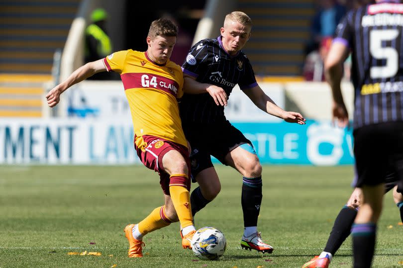 Motherwell's Blair Spittal and St Johnstone's Cammy MacPherson tussle for possession as the sides clashed at Fir Park