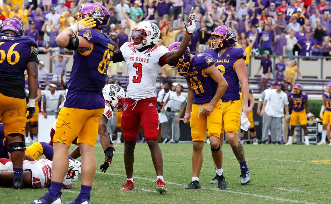 N.C. States Aydan White (3) celebrates after East Carolinas Owen Daffer (41) missed a potential game-winning field goal with five seconds left in the game during N.C. States 21-20 victory over ECU at Dowdy-Ficklen Stadium in Greenville, N.C., Saturday, Sept. 3, 2022.