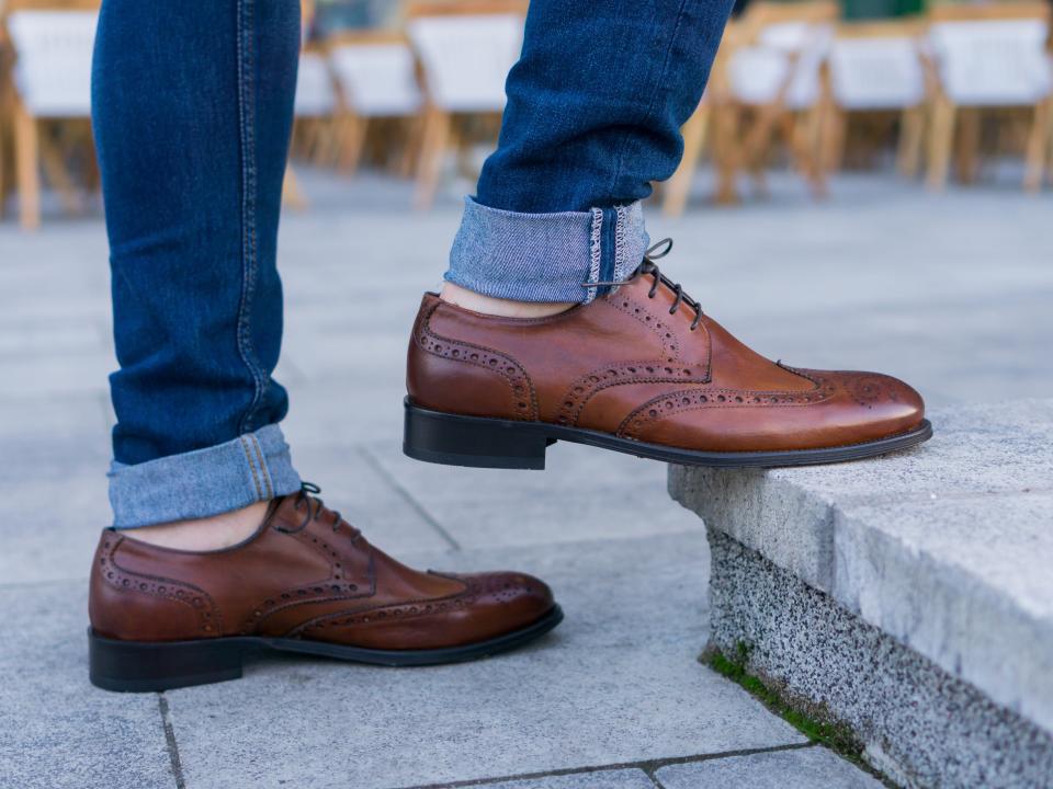 Man wearing brown leather shoes