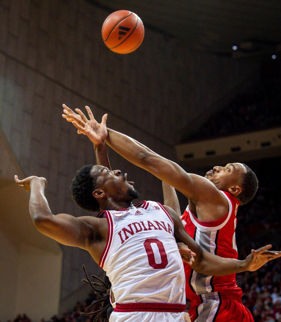 Indiana's Xavier Johnson (0) tosses the pass to Kel'el Ware (1) for a dunk during the first half of the Indiana versus Ohio State men's basketball game at Simon Skjodt Assembly Hall on Saturday, Jan. 6, 2024.