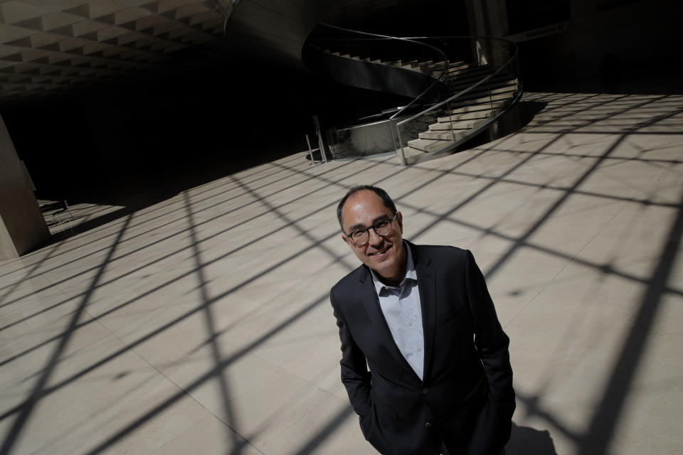 FILE - President-Director of the Louvre museum Jean-Luc Martinez poses during a visit of the Louvre museum Tuesday, June 23, 2020 in Paris. The former Louvre president has been given preliminary charges for antiques trafficking during his tenure as head of the world's most famous museum and home to the Mona Lisa. Jean-Luc Martinez was charged by Paris police Wednesday May 25, 2022 on counts of "complicity in organized fraud" and money laundering, according to the Paris prosecutors' office, which added that he remains under judicial control. (AP Photo/Christophe Ena, File)