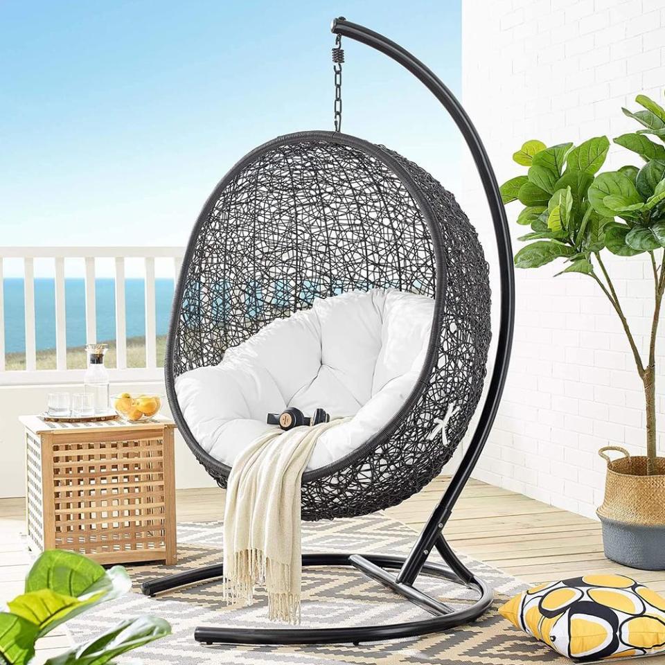 <p><a href="https://go.redirectingat.com?id=74968X1596630&url=https%3A%2F%2Fwww.wayfair.com%2F--%2Fpdp%2Fmodway--encase-suspension-series-outdoor-porch-swing-with-stand-eei739-l172-w005616014.html&sref=https%3A%2F%2Fwww.elle.com%2Ffashion%2Fshopping%2Fg60412443%2Fmost-comfortable-outdoor-chairs%2F" rel="nofollow noopener" target="_blank" data-ylk="slk:Shop Now;elm:context_link;itc:0;sec:content-canvas" class="link ">Shop Now</a></p><p>Encase Suspension Series Outdoor Porch Swing with Stand</p><p>wayfair.com</p><p>$658.44</p>