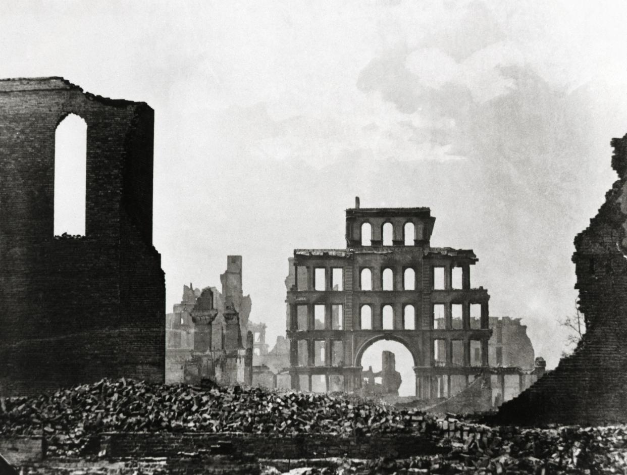 Photo shows rubble and shells of buildings after the Chicago fire 1871.